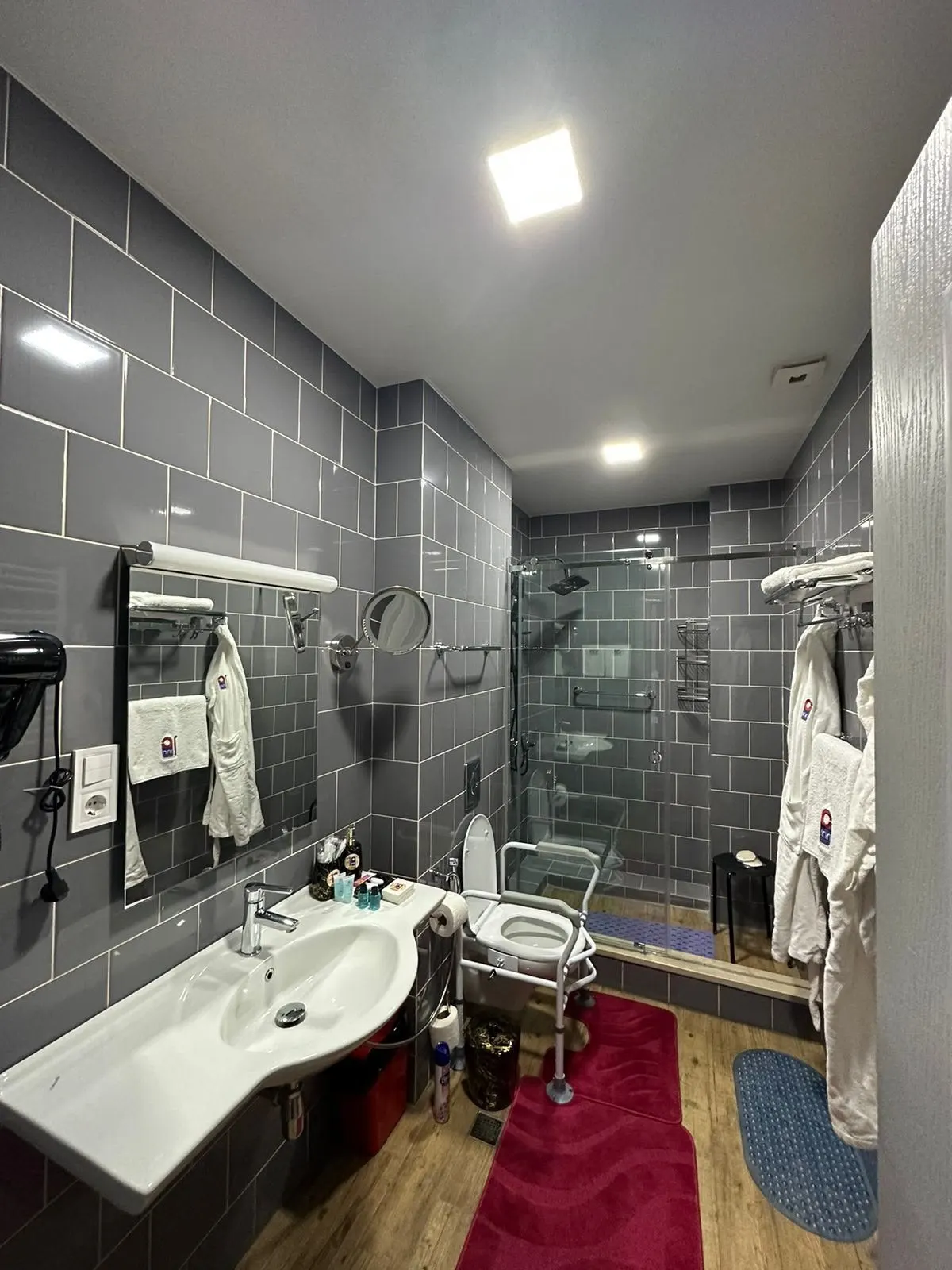 Bathroom vanity with robes and fresh towels