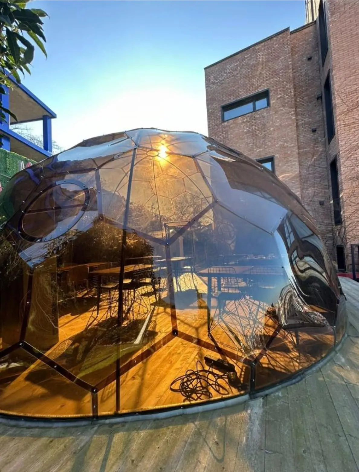 The glass dome on its timber deck at golden hour
