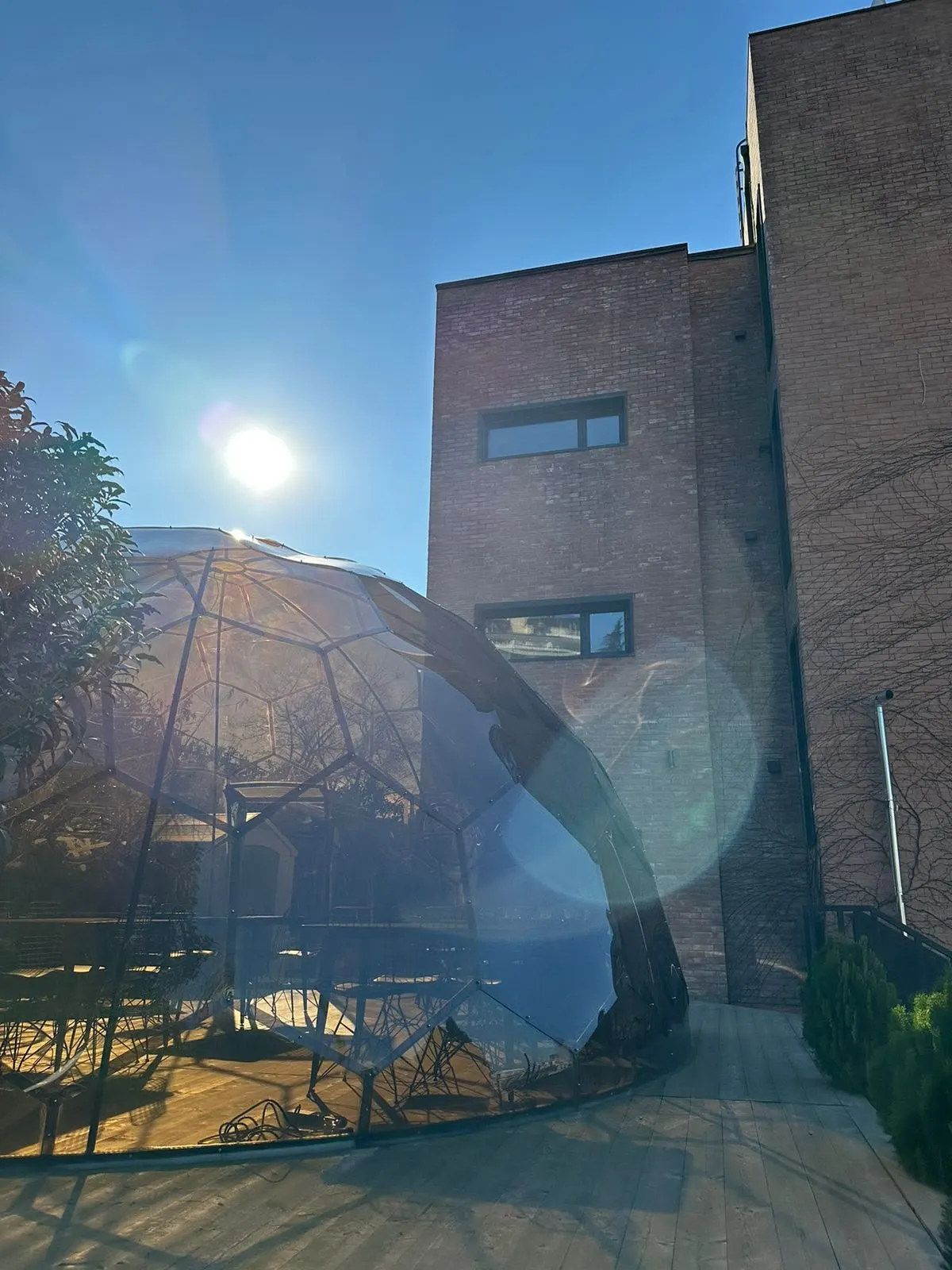 The dome glinting in the afternoon sun beside the hotel